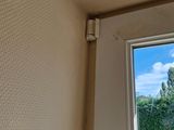 a small window in the corner of a room