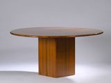 an image of a wooden table with a round top on a white background