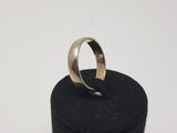 a silver ring sitting on top of a black box