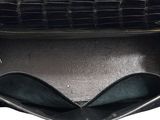 the inside of a black purse with a zipper on top of it