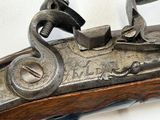 a close up of a gun on a white background