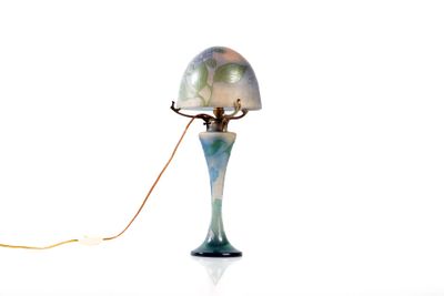 a lamp that is sitting on a table with a cord attached to it
