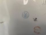 a picture of a plate with stamps on it