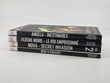 three books are stacked on top of each other on a white surface