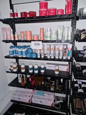 a shelf with many different types of beauty products on it