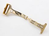 a close up of a razor on a white surface