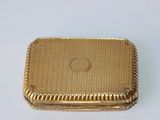 an image of a gold plated box on a white surface