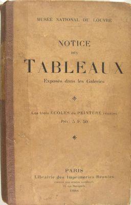 un vieux livre posé sur une nappe blanche