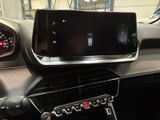 a car dashboard with a phone in the center of it