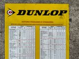 yellow and black sign on the ground with information about the various parts of the machine