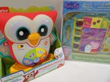 a toy owl that is sitting next to a box of toys
