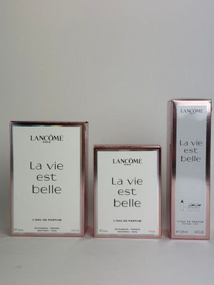 three bottles of lancome la vie teste and a box of lancome la vie teste