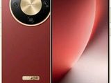un gros plan d'un téléphone rouge muni d'un bouton doré