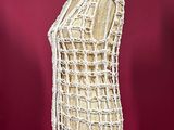 a white crocheted vest on a mannequin mannequin mannequin mannequin mannequin mannequin mannequin mannequin