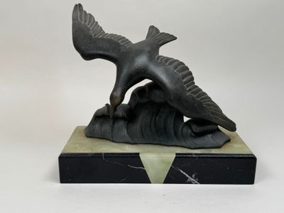 sculpture of a bird on a rock on a white background