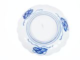 a white plate with a blue design on it