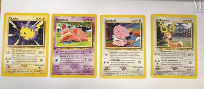 four pokemon cards are lined up on top of each other