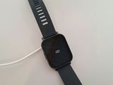 an apple watch is connected to a charger on a table