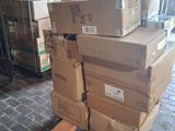 many boxes stacked on a pallet in a warehouse