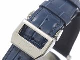 a close up of a watch with a blue strap