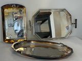 a silver tray with a mirror and a mirror on it
