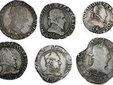 six pièces de monnaie romaines antiques, dont l'une représente un buste et l'autre est un buste
