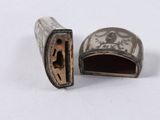 an image of a small metal object with a bird on it ' s side