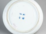 a white plate with a blue design on it