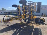 a close up of a tractor mounted on top of a pile of dirt