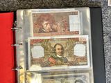 two different bills in a binder on a table