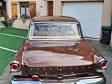 a brown car parked on the side of the road
