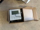 a box that has a remote and a remote control in it