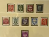 a close up of a picture of a collection of stamps on a wall