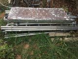 a pile of metal items sitting in the grass