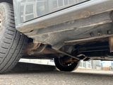 the rear end of a truck with a flat tire on the road