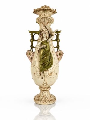 a statue of a woman holding a vase on a white surface