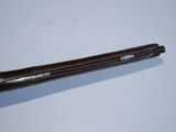 an old baseball bat sitting on top of a table next to a baseball bat
