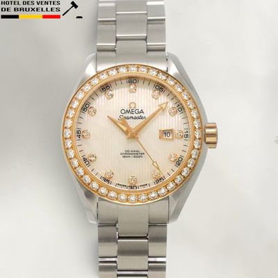a watch that is sitting on a white surface