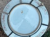 a plate that is sitting on the ground on the ground