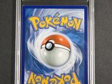 a close up of a pokemon card in a plastic case