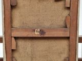 an image of a picture of a wooden frame with a number on it