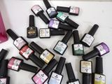 many bottles of nail polish sitting on a table