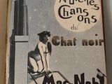 a book with a picture of a woman sitting on a chair