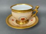 an image of a cup and saucer sitting on a table