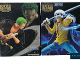 they are two books of one piece action figures, one with green hair and one with green hair and one with green hair