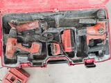 many tools in a tool box on the floor