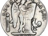 un gros plan d'une pièce d'argent sur laquelle figure un ange