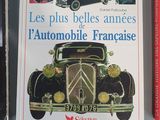 three books on a table with a picture of an old car and other cars