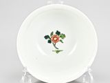 an image of a white plate with a red rose on it