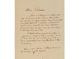 une lettre écrite à l'encre noire sur une feuille de papier
